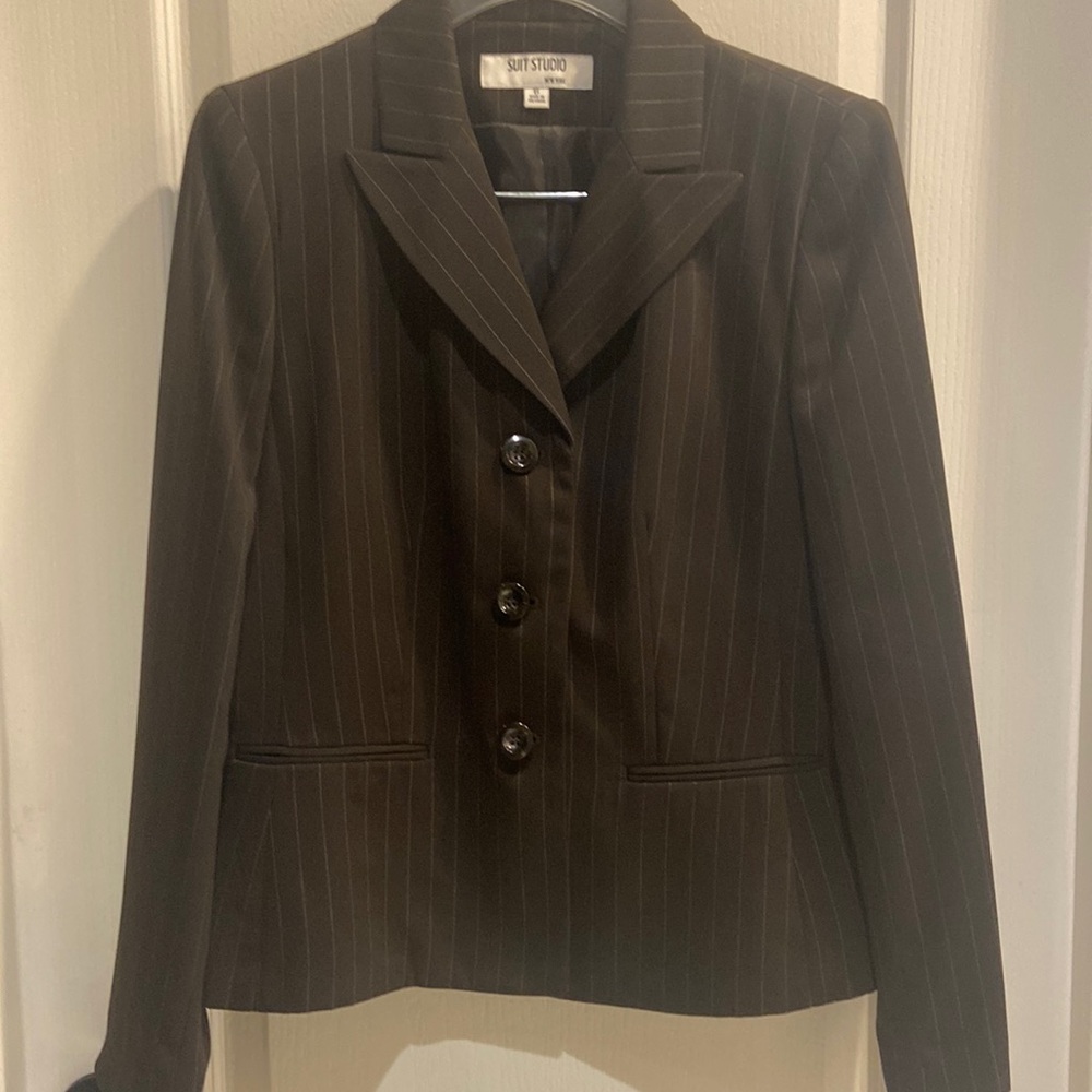 2 piece pant suit. Dark brown pin stripe. Very well taken care of.